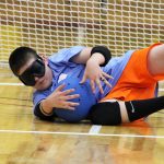 Young Athlete Blocking Goalball Shot