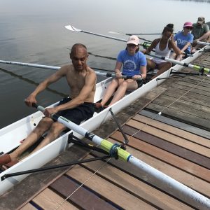 Prateek in Dragon Boat with fellow volunteers and blind athletes
